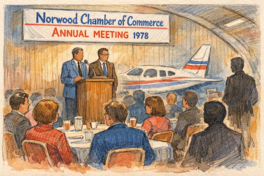 Illustration of a chamber of commerce annual meeting in 1978, featuring two speakers at a podium, an audience seated at tables, and a small airplane displayed in the background.