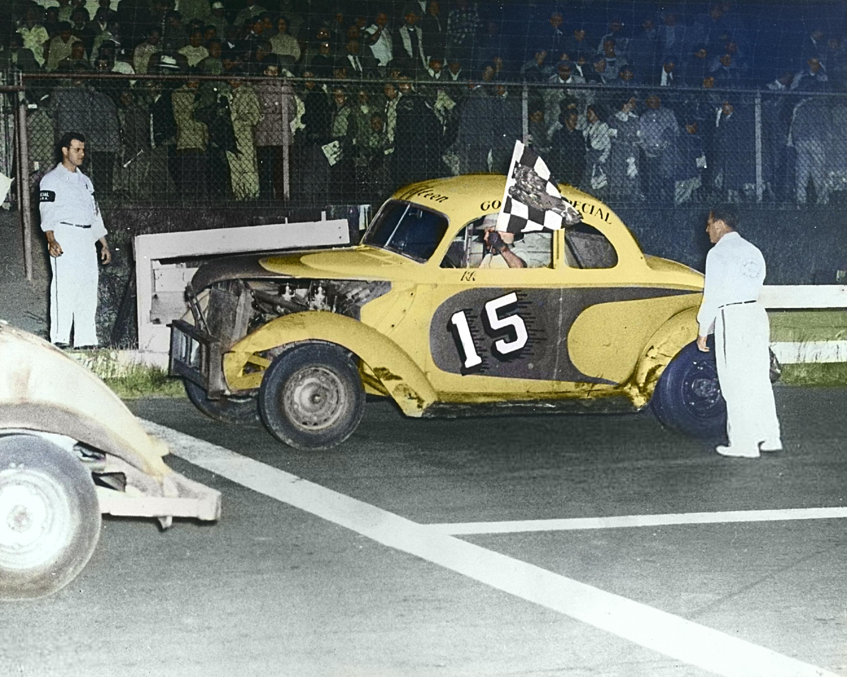 Early 1950s:  Ray Janelle raced Stock Cars like this one late in his career after a long tenure as a champion motorcycle racer.  Janelle was a regular competitor at the Norwood (MA) Arena for several seasons.  (Photo by ISC Images & Archives via Getty Images-colorized by the Norwood Historical Society)