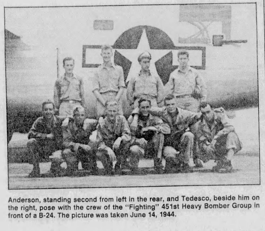 Group photo of the crew from the 'Fighting' 451st Heavy Bomber Group in front of a B-24, taken on June 14, 1944.